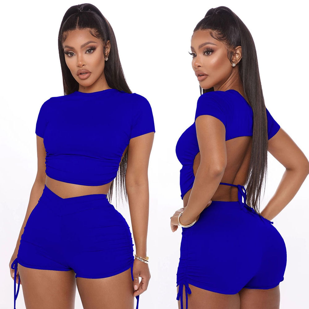 Two Piece Solid Open Back Crop Top With Matching Stacked Elastic Waist Shorts.