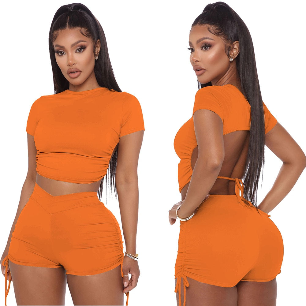 Two Piece Solid Open Back Crop Top With Matching Stacked Elastic Waist Shorts.