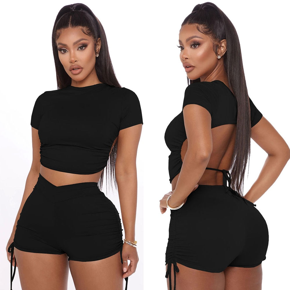 Two Piece Solid Open Back Crop Top With Matching Stacked Elastic Waist Shorts.